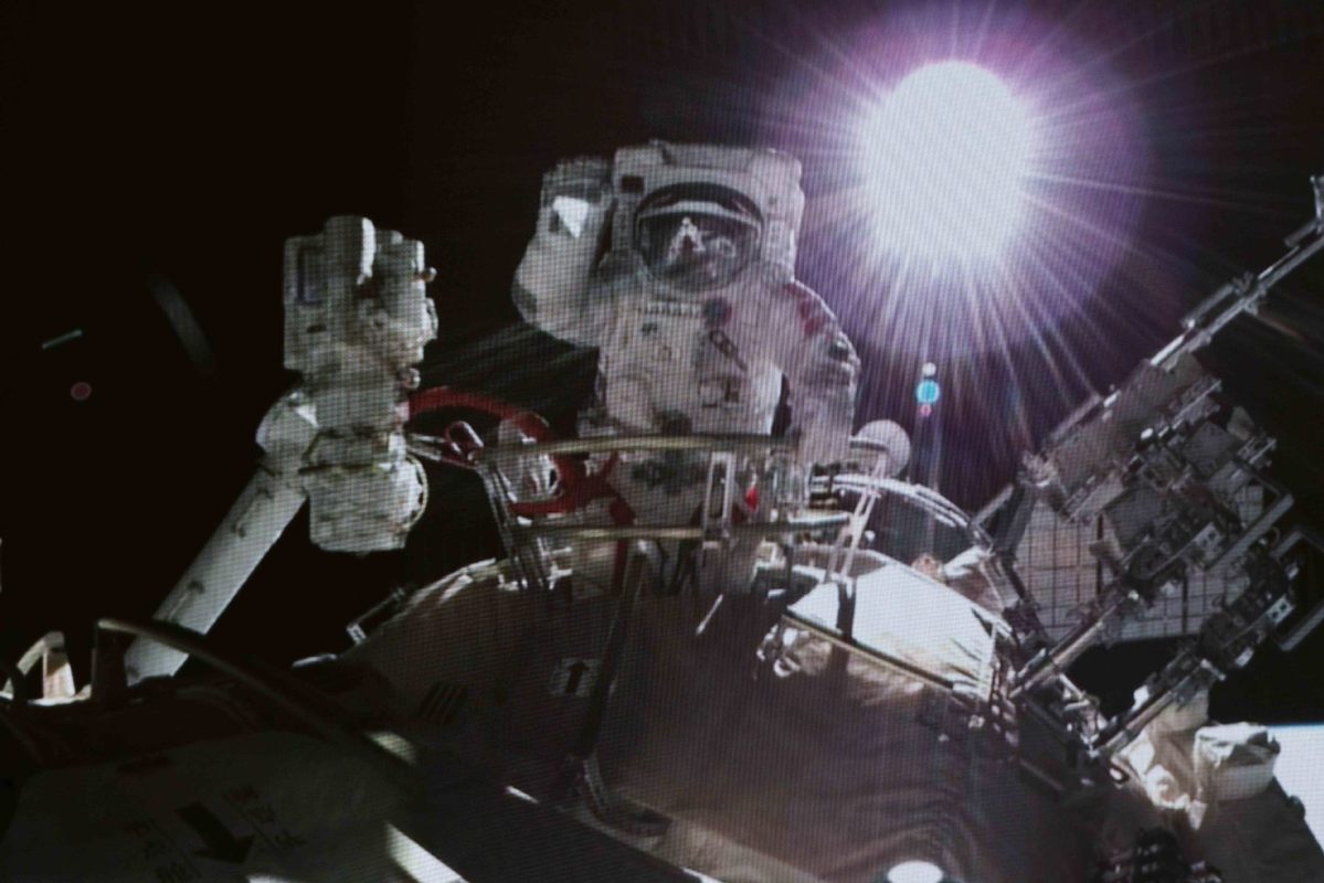 Astronaut in orbit conducts a historic spacewalk